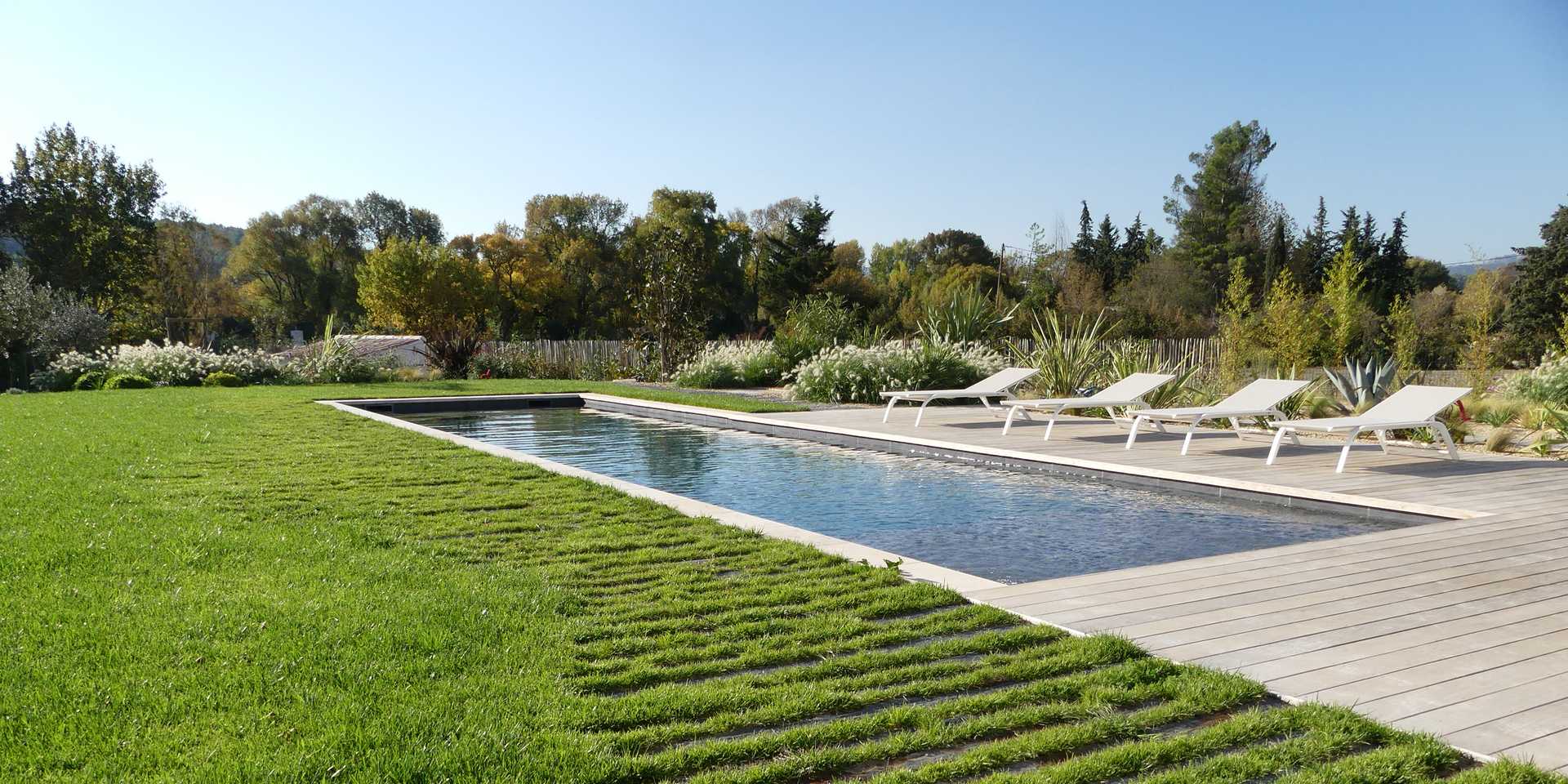 Mediterranean garden with swimming pool designed by a landscape gardener